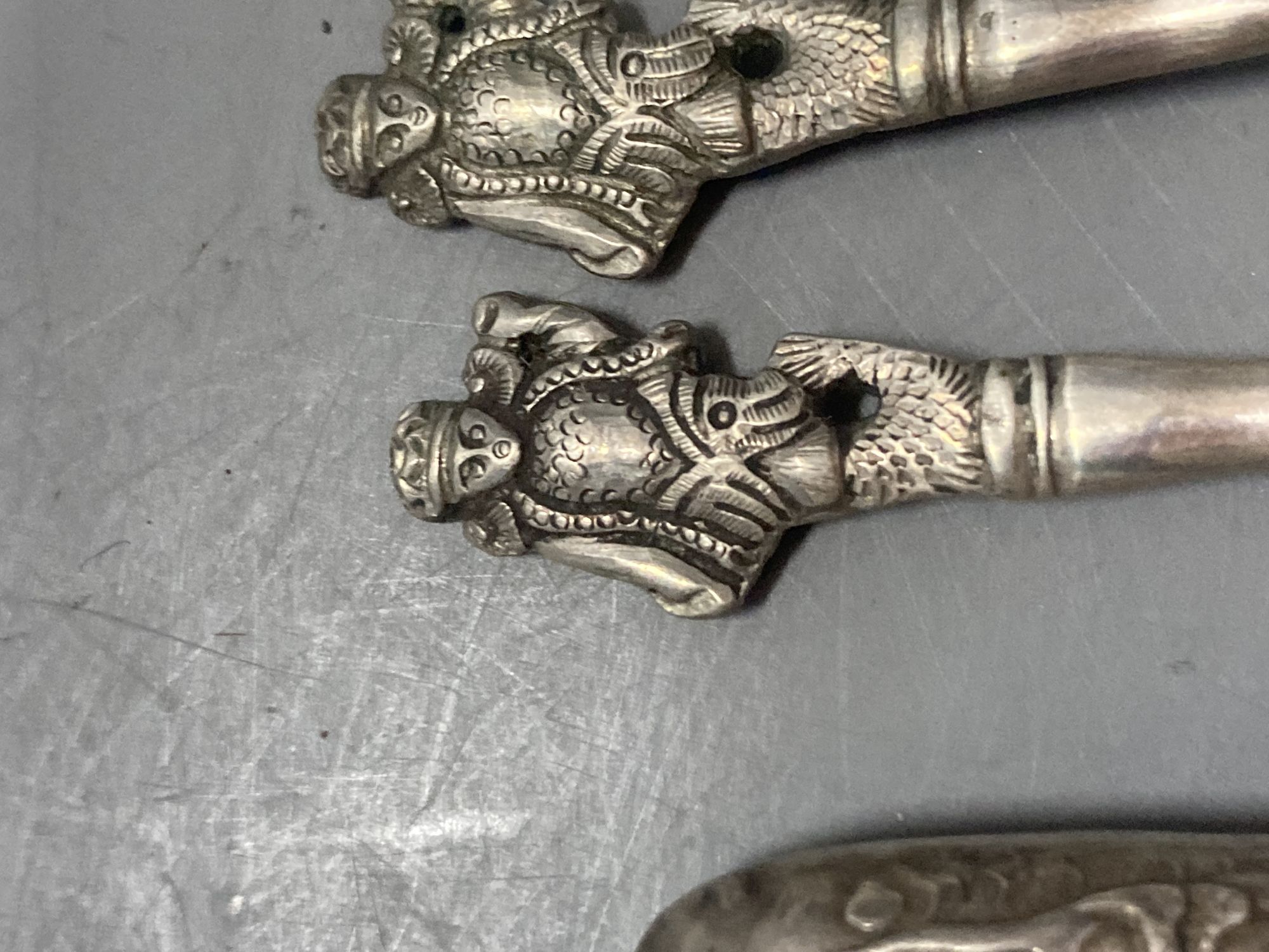 A group of assorted Chinese white metal spoons and forks, including set of six teaspoons and ten small items of English silver.